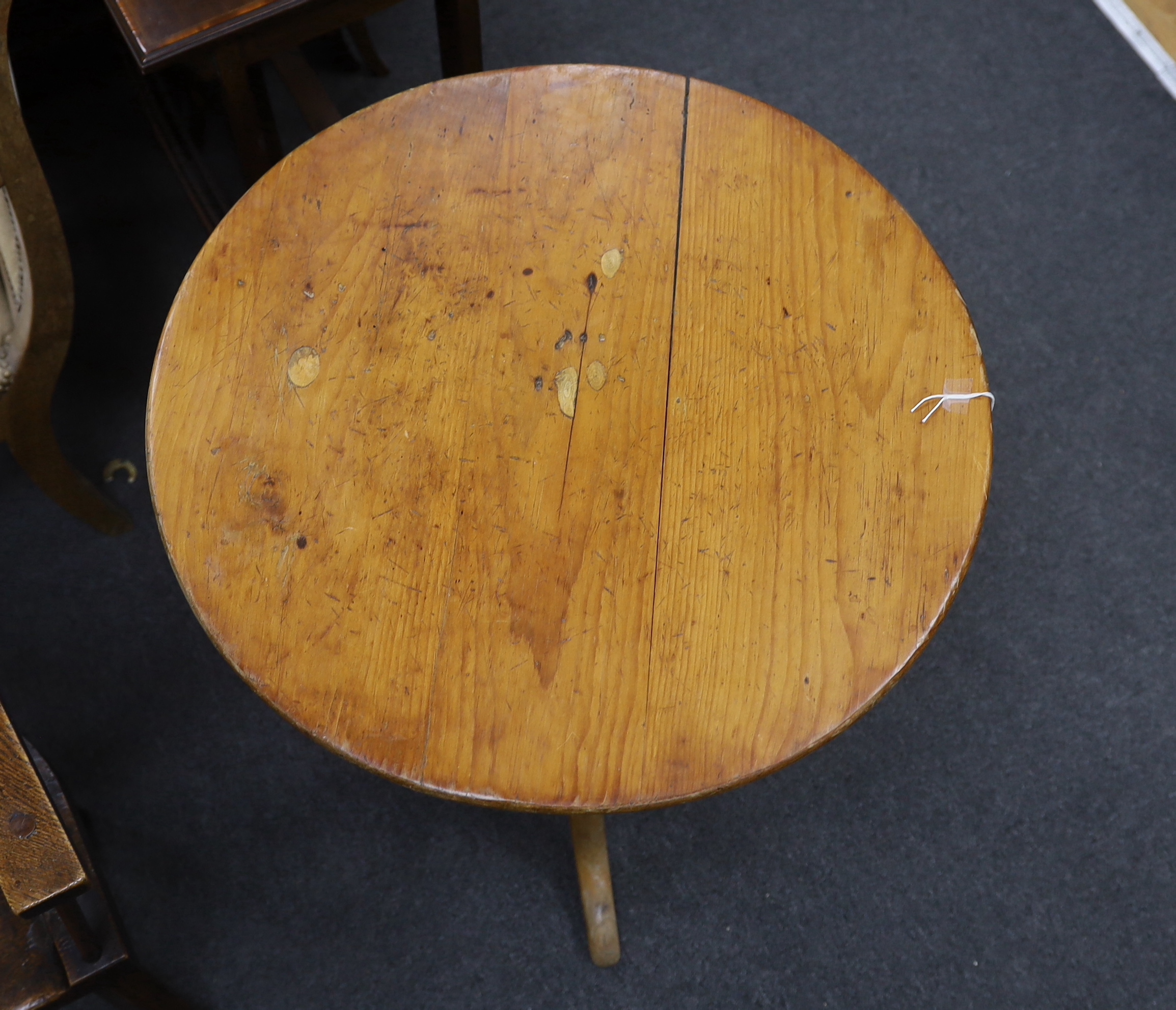 A 19th century circular pine tripod tea table, diameter 60cm, height 71cm
